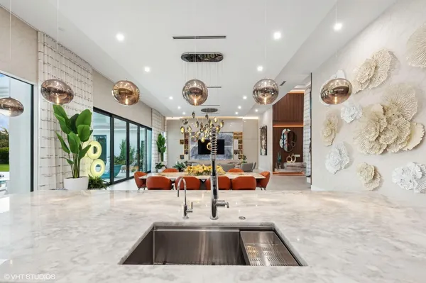 a large kitchen with a sink and dishwasher