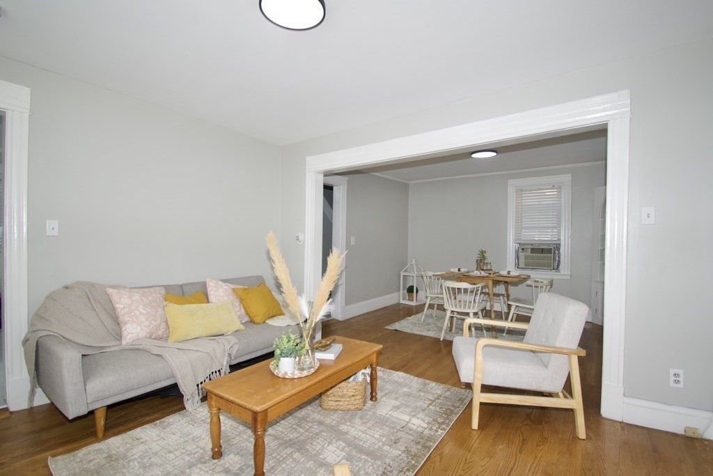 19 Agnes Street Springfield, MA 01118 - Photo 6 of 34 a living room with furniture and a wooden floor