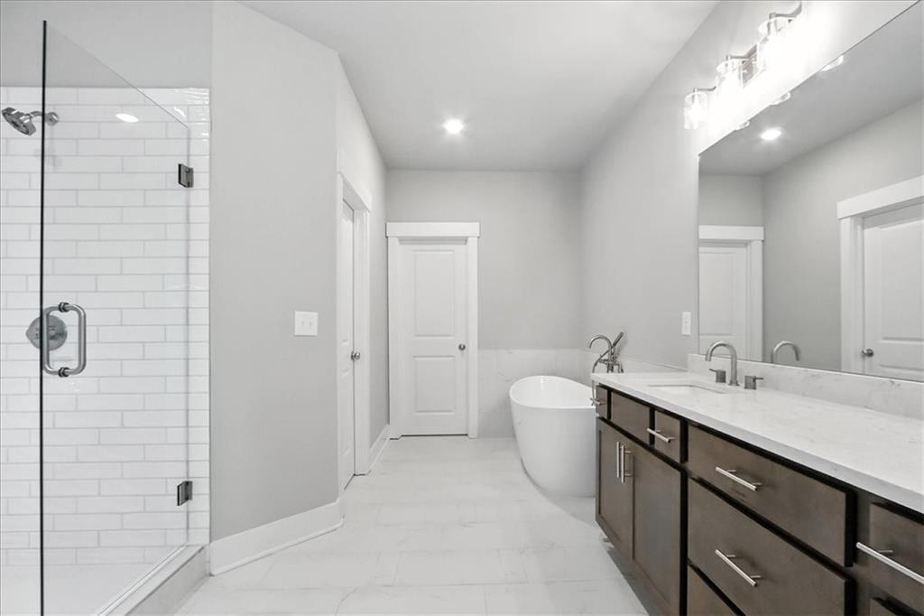 95 Old Town Road Dacula, GA 30019 - Photo 44 of 74 a spacious bathroom with a double vanity sink mirror and double