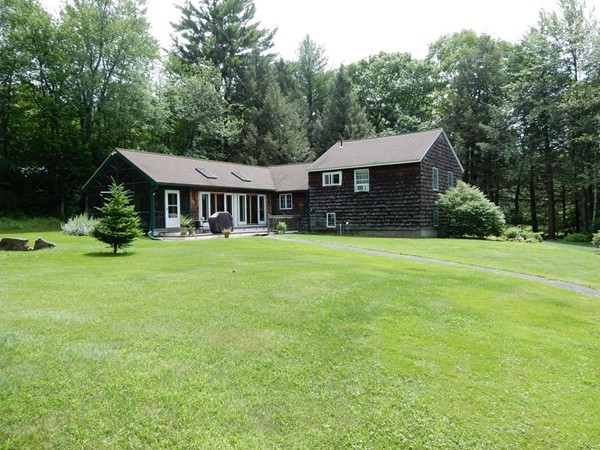 75 Brooks Village Road Phillipston, MA 01331 - Photo 1 of 30 a front view of a house with yard and green space