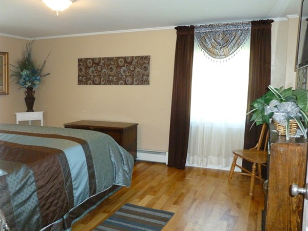 75 Brooks Village Road Phillipston, MA 01331 - Photo 23 of 30 a bedroom with a bed and a potted plant on the dresser