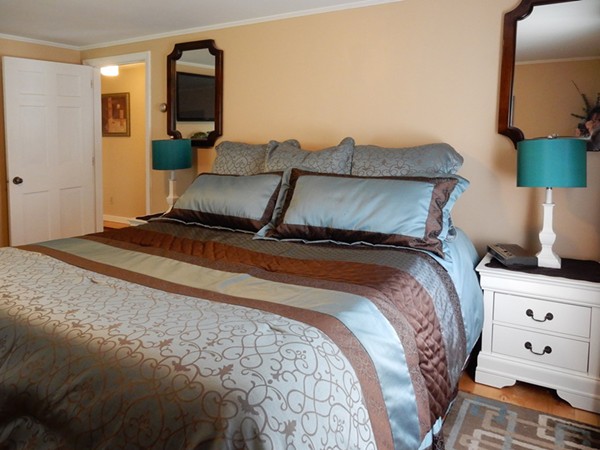 75 Brooks Village Road Phillipston, MA 01331 - Photo 24 of 30 a bed sitting in a bedroom next to a lamp