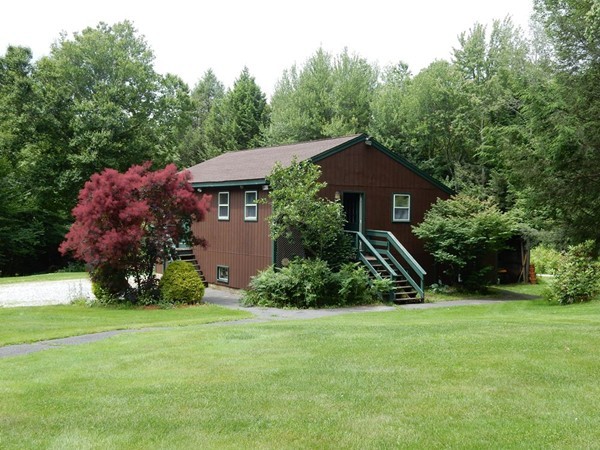 75 Brooks Village Road Phillipston, MA 01331 - Photo 4 of 30 a front view of a house with a yard and trees