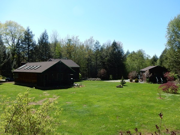 75 Brooks Village Road Phillipston, MA 01331 - Photo 5 of 30 a view of an house with a yard and trees