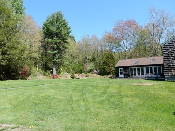 75 Brooks Village Road Phillipston, MA 01331 - Photo 6 of 30 a backyard of a house with table and chairs