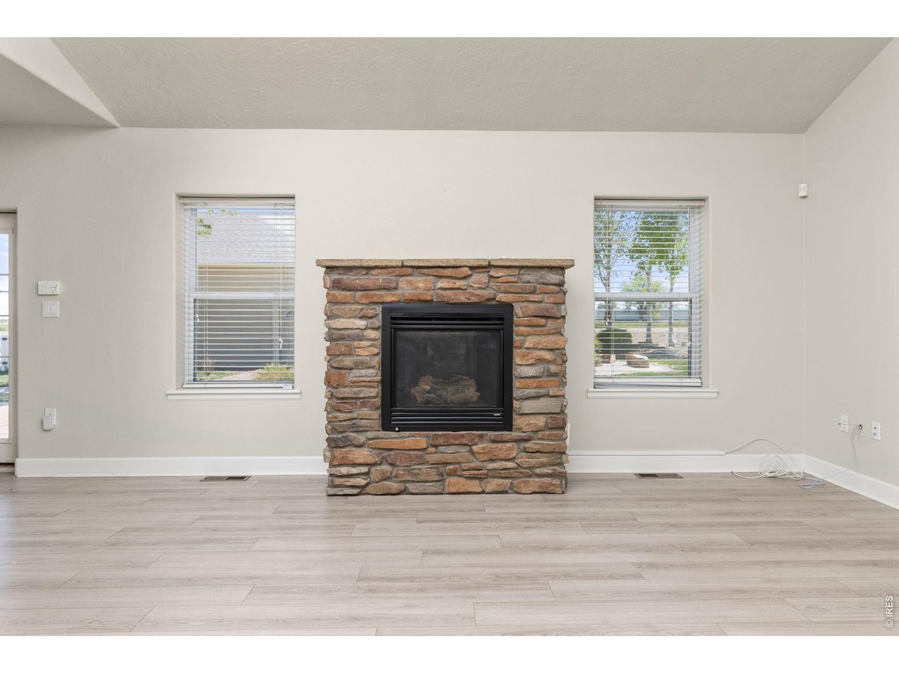 2002 Trail Ridge Drive Severance, CO 80615 - Photo 13 of 50 Inside, the ranch-style layout offers an open, vaulted living area with a gas fireplace, fully updated kitchen, and a main-level primary suite.