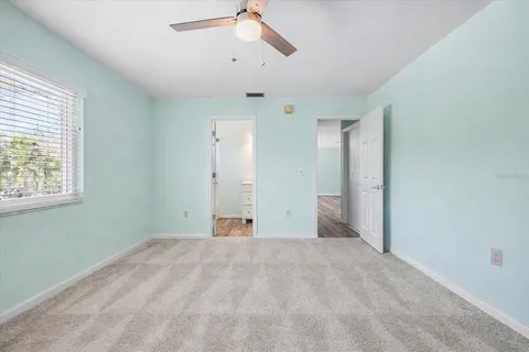 a view of empty room with a ceiling fan