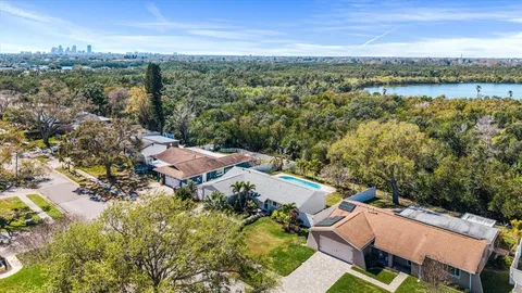 an aerial view of a house with a lake view