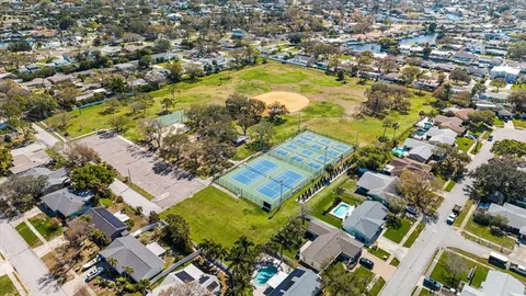 an aerial view of residential houses with outdoor space