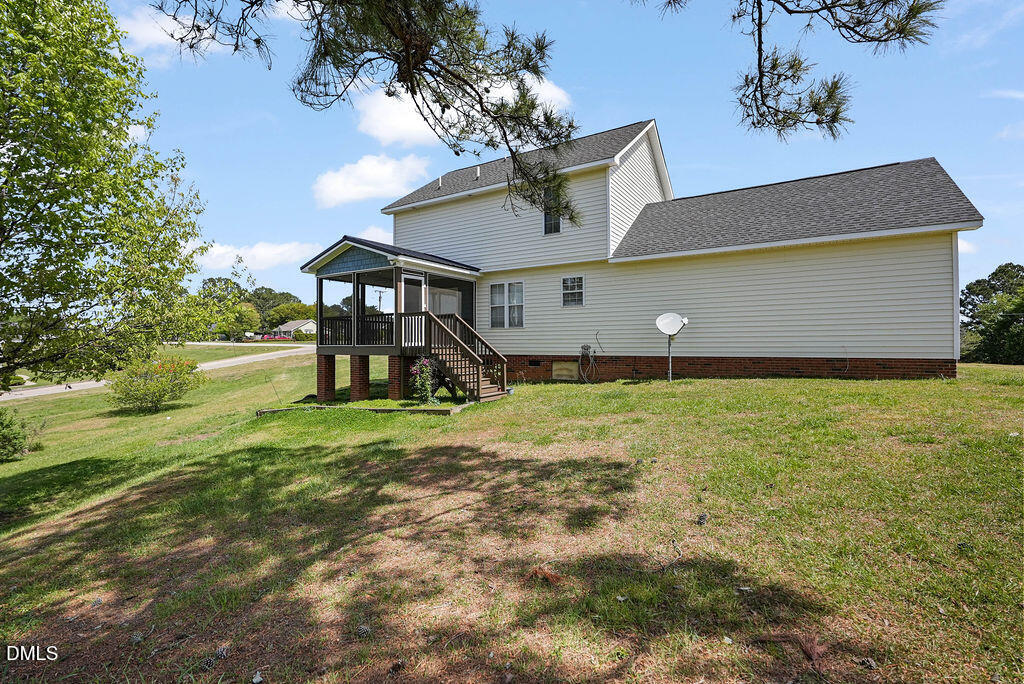 1560 Cane Mill Road Coats, NC 27521 - Photo 32 of 32 a front view of a house with garden