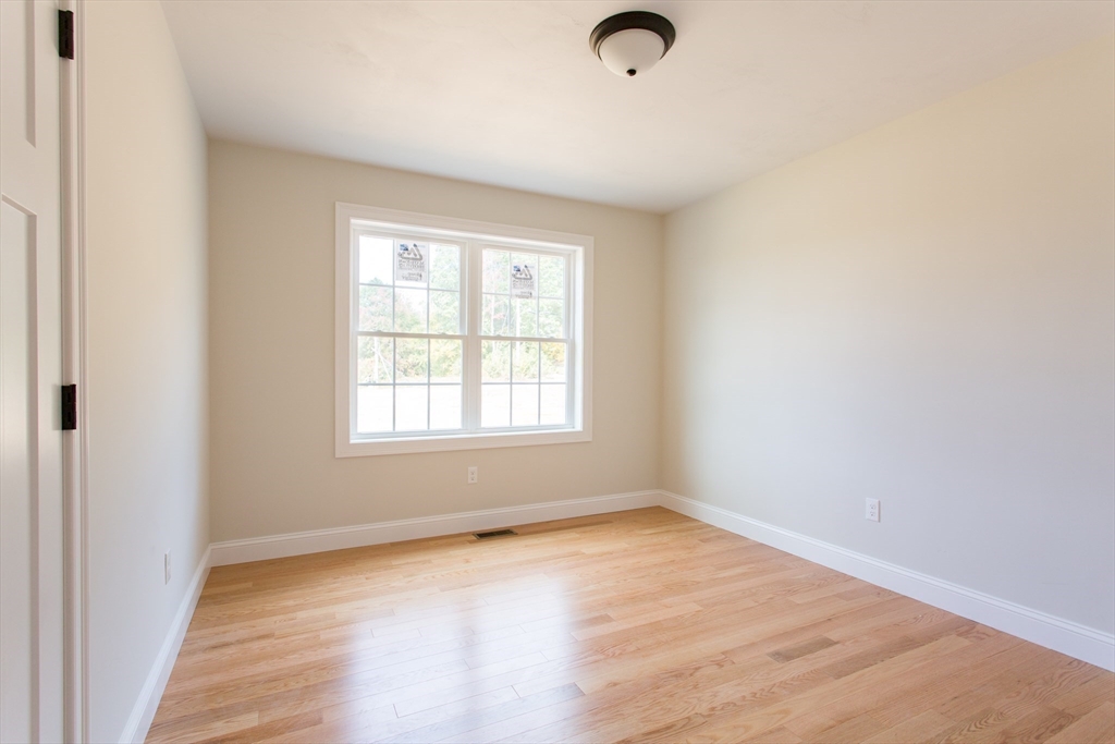 8 Foster Road West Brookfield, MA 01585 - Photo 16 of 29 an empty room with wooden floor and windows