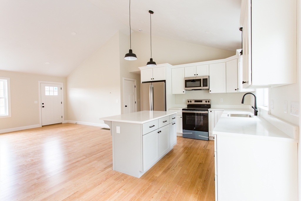 8 Foster Road West Brookfield, MA 01585 - Photo 6 of 29 a kitchen with stainless steel appliances granite countertop a sink a stove top oven a counter space and cabinets