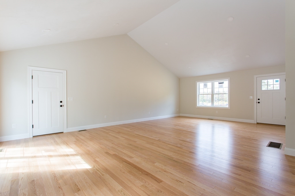 8 Foster Road West Brookfield, MA 01585 - Photo 9 of 29 a view of an empty room with wooden floor and window
