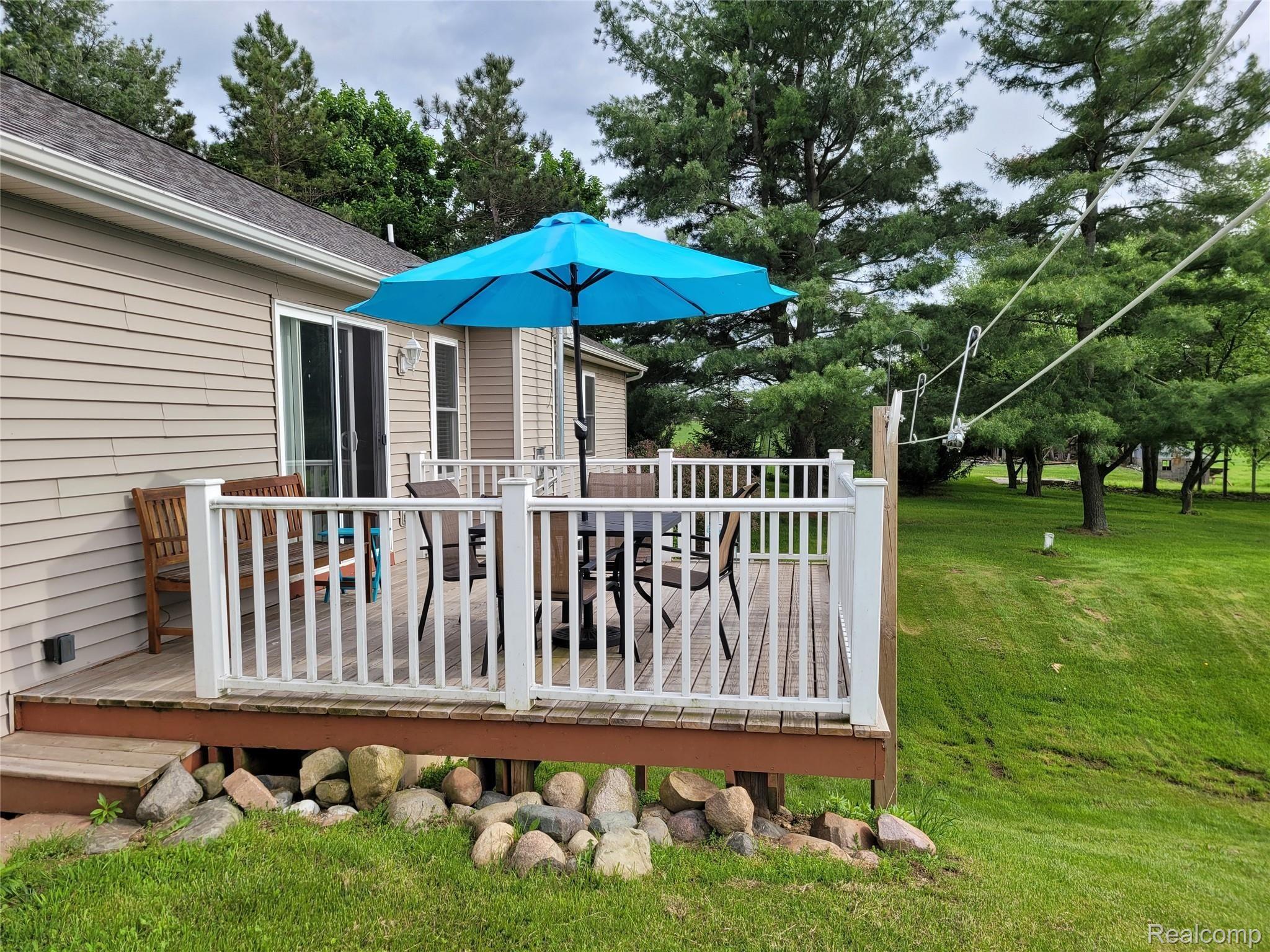 9235 North Fowlerville Road Fowlerville, MI 48836 - Photo 4 of 31 9235 Rear Deck.jpg