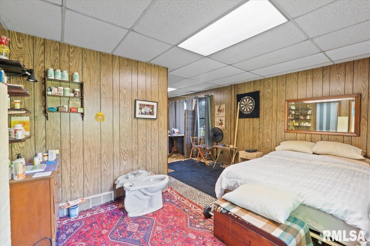 3302 38th Avenue Moline, IL 61265 - Photo 11 of 29 a bedroom with a bed and wooden floor