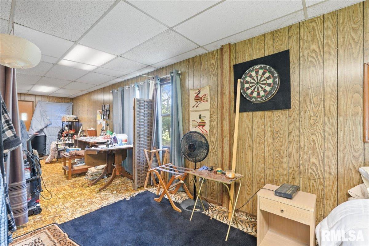 3302 38th Avenue Moline, IL 61265 - Photo 13 of 29 a view of a workspace with furniture and floor to ceiling window