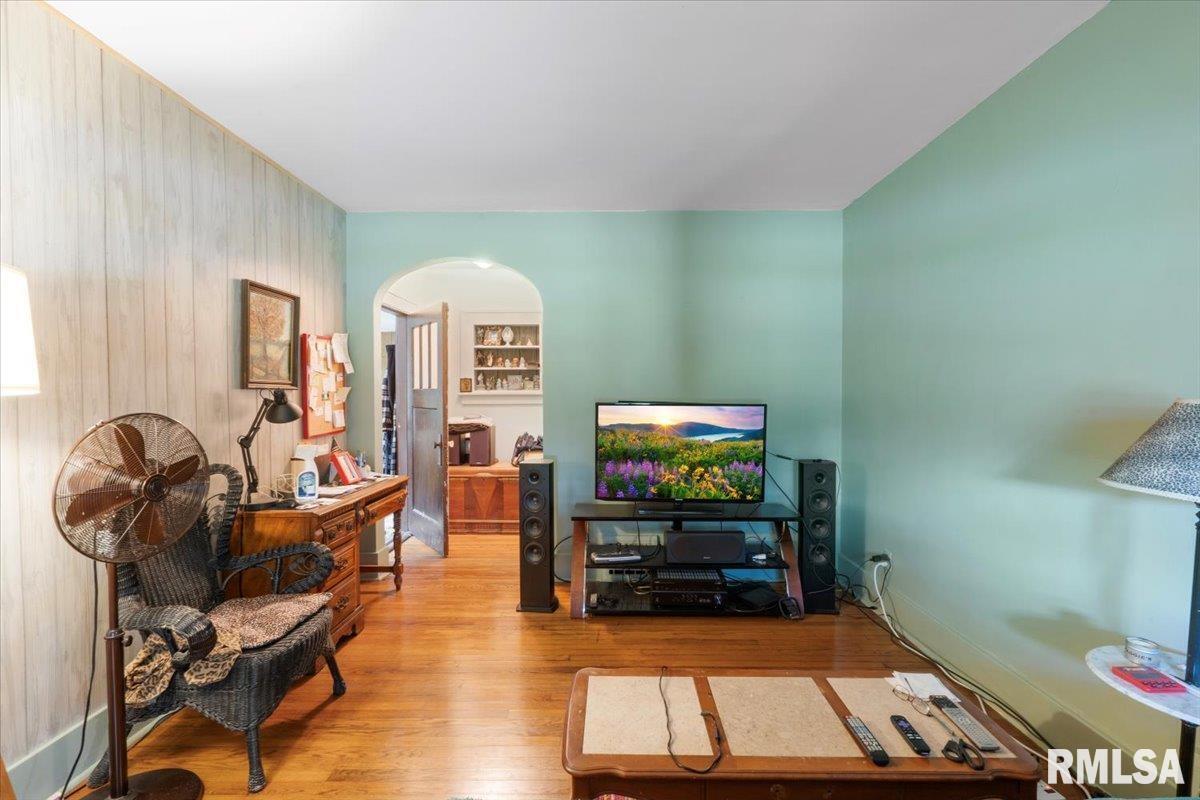 3302 38th Avenue Moline, IL 61265 - Photo 15 of 29 a living room with furniture and a flat screen tv