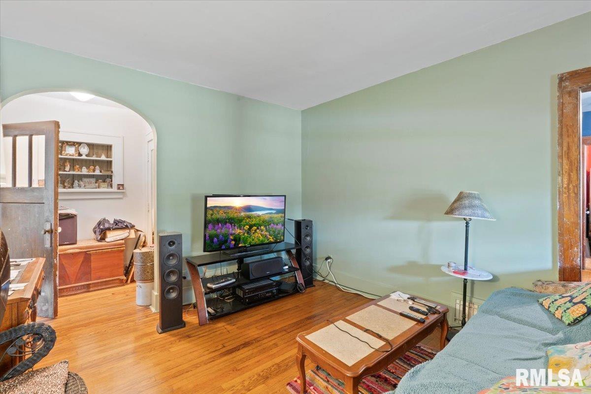 3302 38th Avenue Moline, IL 61265 - Photo 16 of 29 a living room with furniture and a flat screen tv