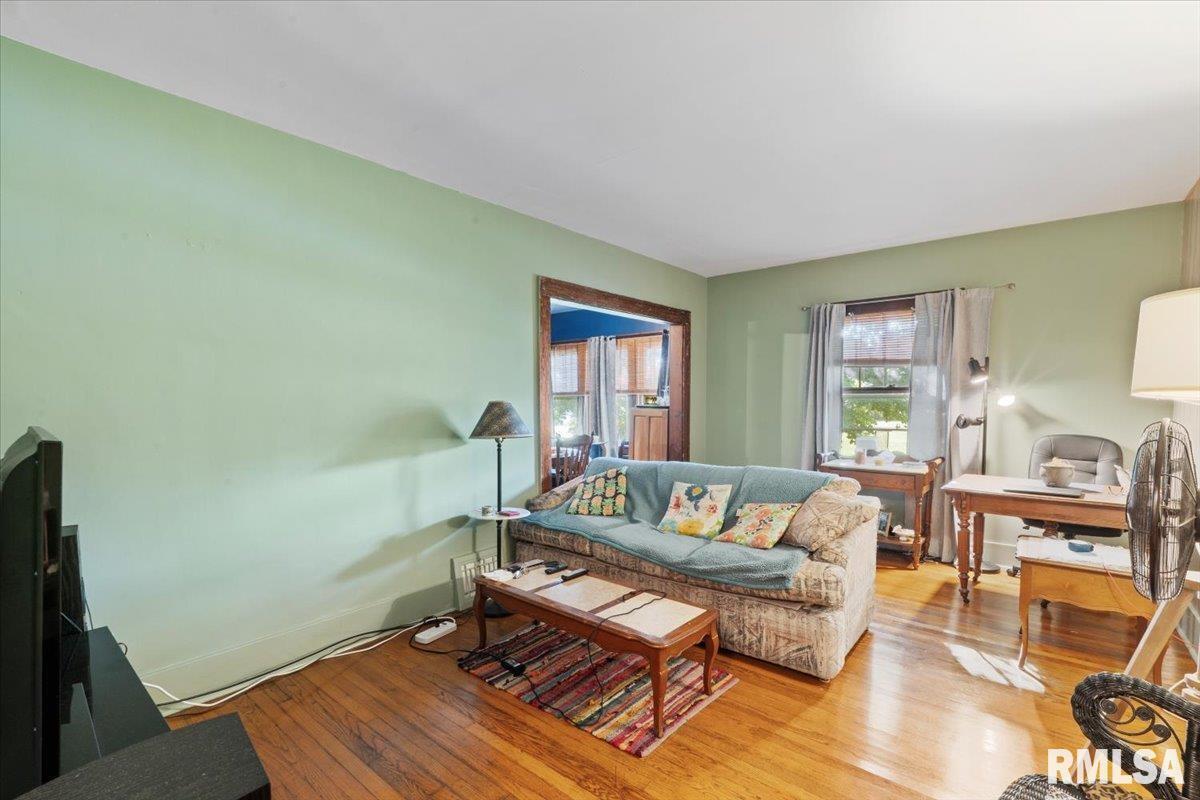 3302 38th Avenue Moline, IL 61265 - Photo 17 of 29 a living room with furniture and a window