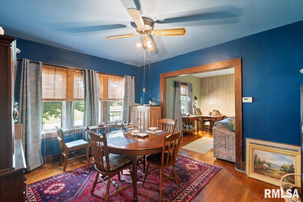 3302 38th Avenue Moline, IL 61265 - Photo 20 of 29 a view of a dining room with furniture window and wooden floor