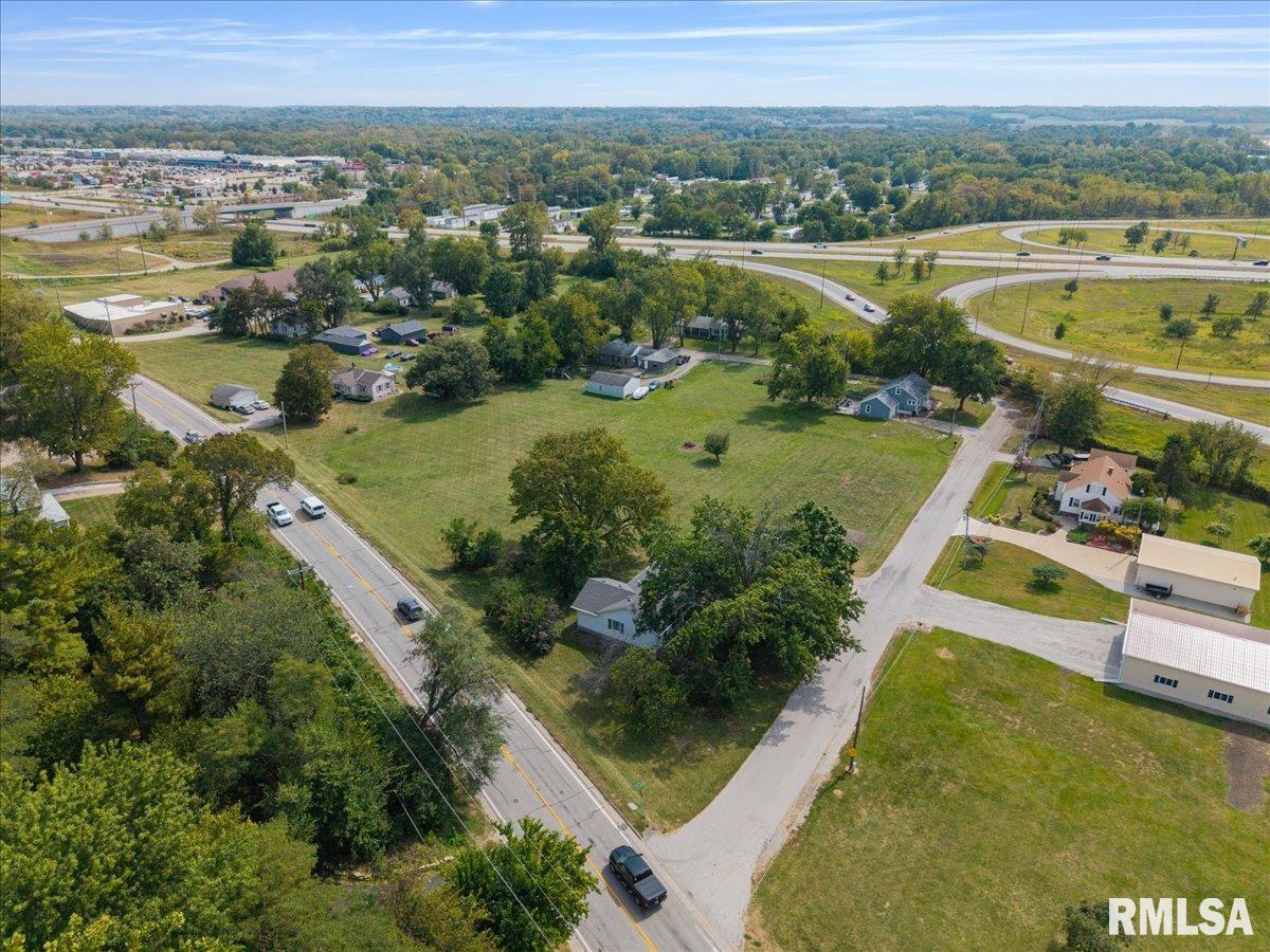 3302 38th Avenue Moline, IL 61265 - Photo 3 of 29 an aerial view of residential houses with outdoor space and swimming pool
