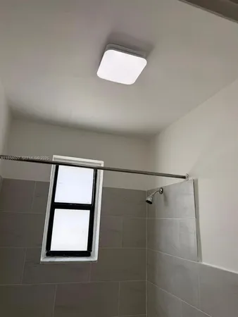 a bathroom with a sink and a window
