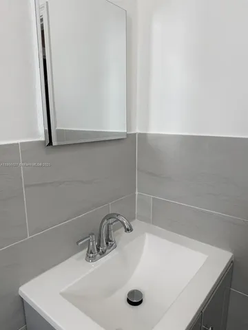 a bathroom with a shower and a toilet