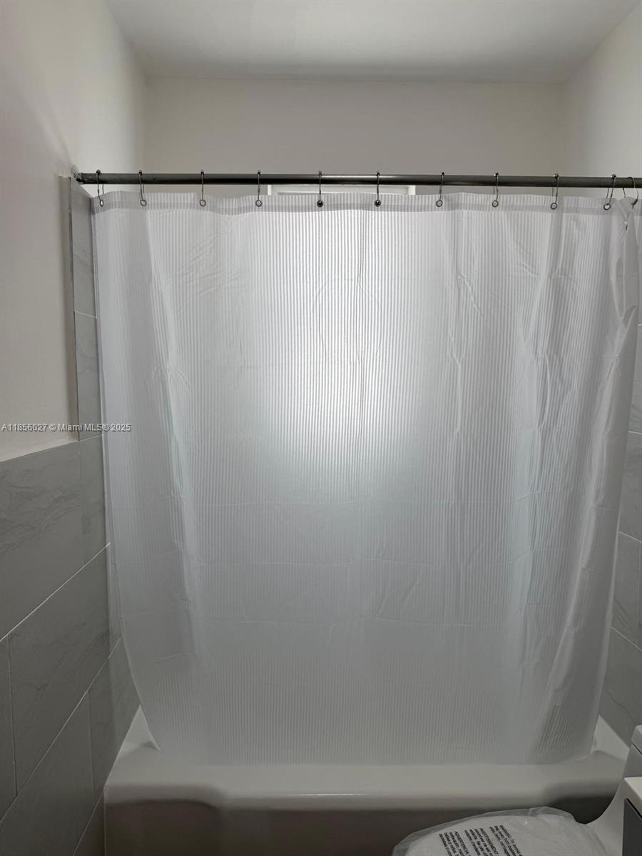 1432 Northeast 163rd Street, Unit 2 North Miami Beach, FL 33162 - Photo 18 of 18 a close view of walk in closet