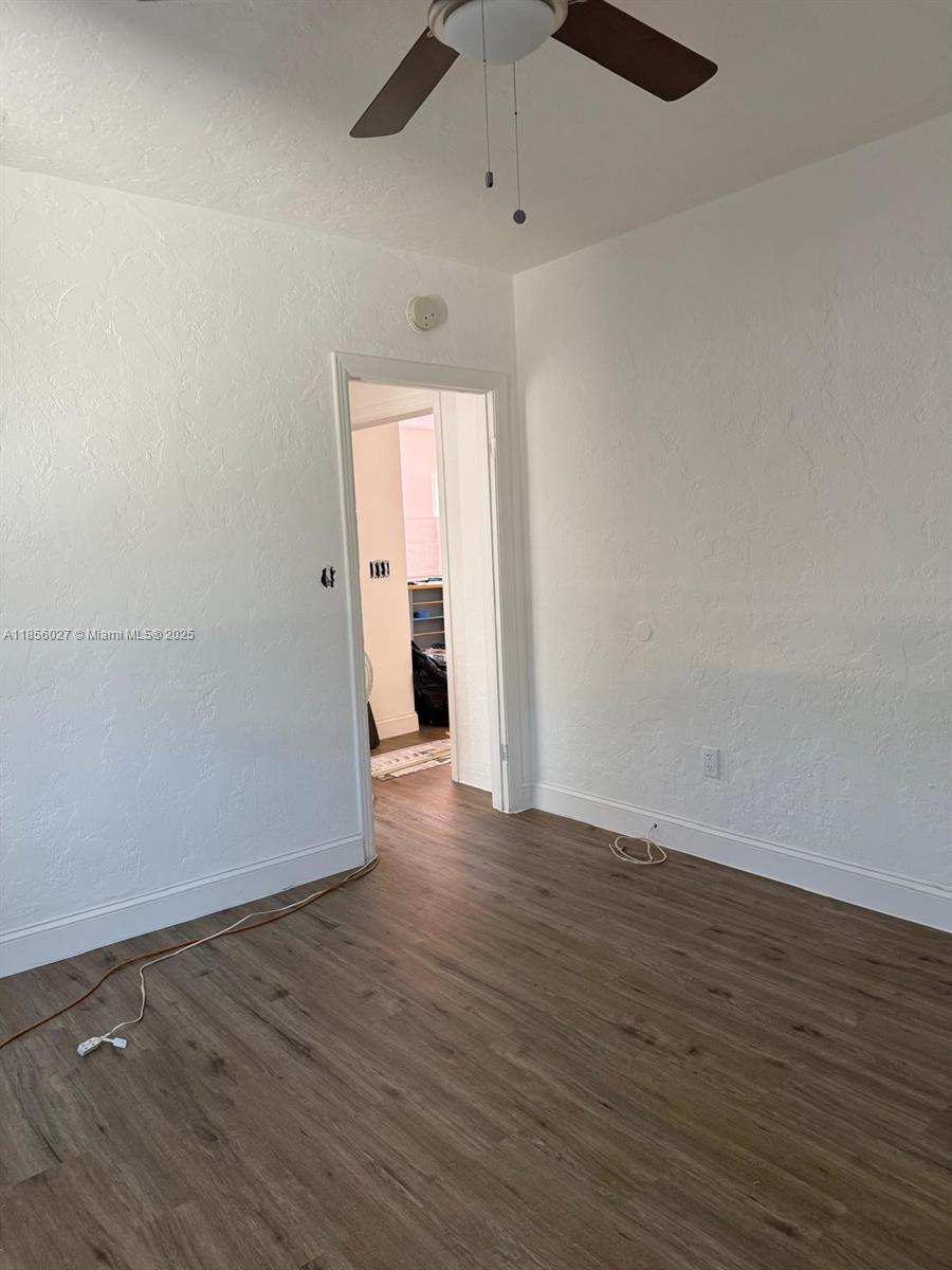 1432 Northeast 163rd Street, Unit 2 North Miami Beach, FL 33162 - Photo 8 of 18 wooden floor in an empty room