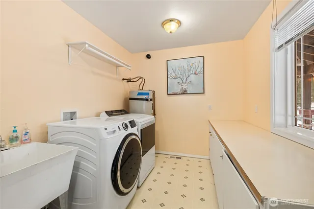 a utility room with dryer and washer
