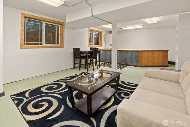 a living room with furniture and a window