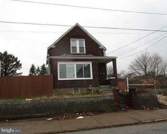 a front view of a house with garage
