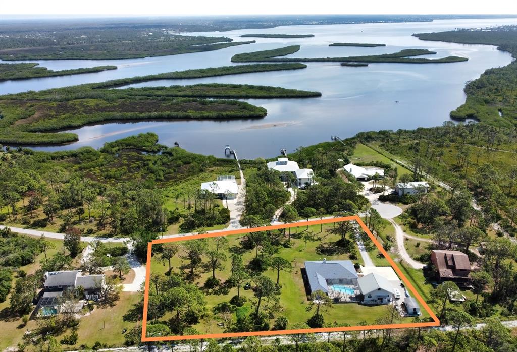 an aerial view of a residential houses with outdoor space