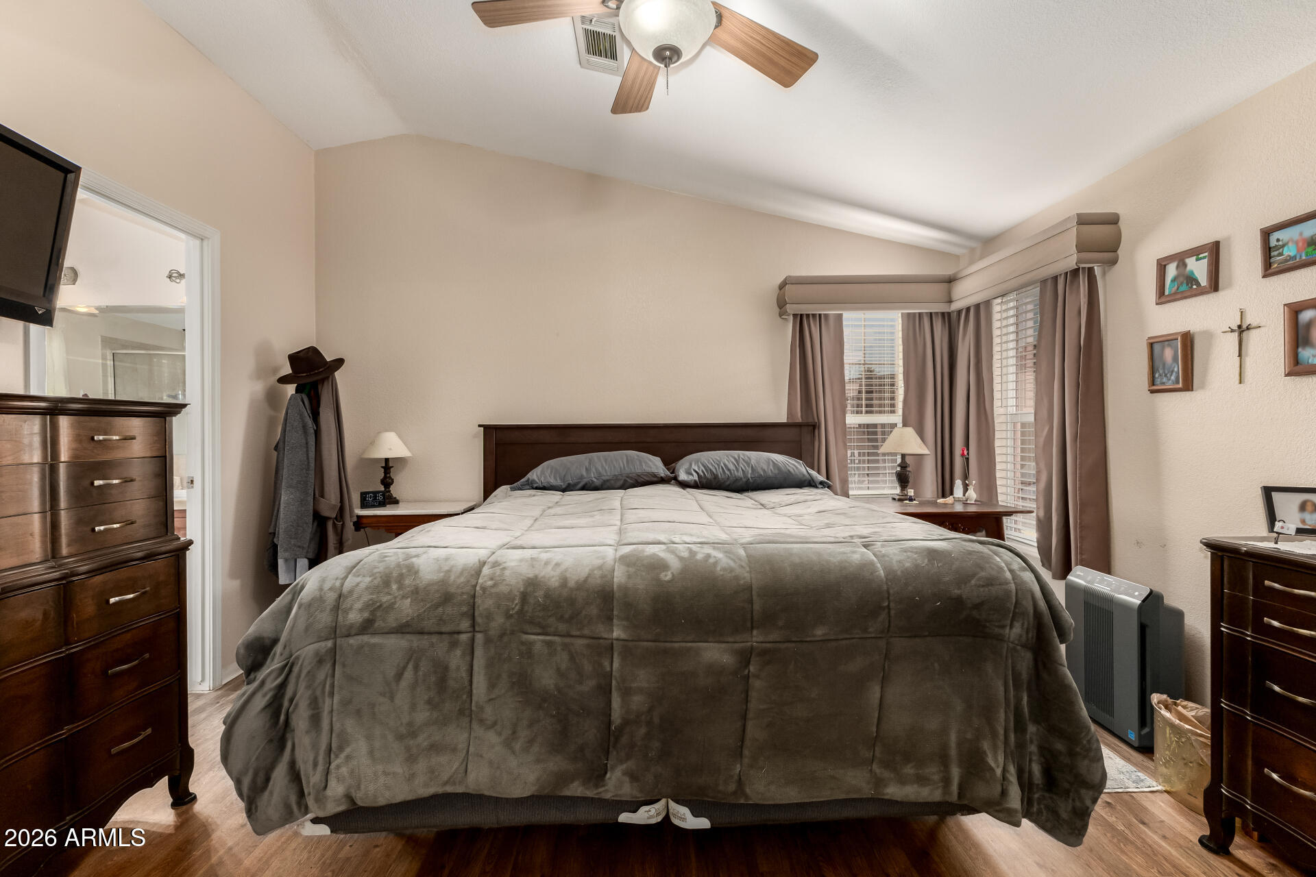 201 South Greenfield Road, Unit 124 Mesa, AZ 85206 - Photo 13 of 31 a bedroom with a bed and a flat tv screen