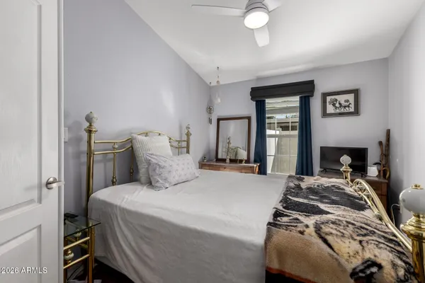 a bedroom with a bed and a fireplace