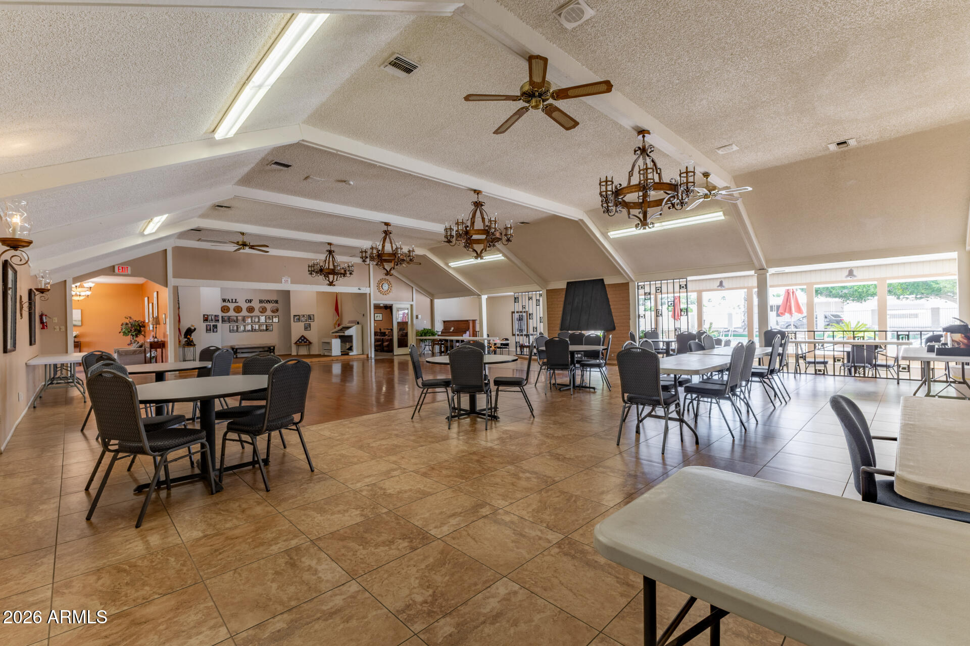 201 South Greenfield Road, Unit 124 Mesa, AZ 85206 - Photo 28 of 31 a view of a dining room with furniture and a chandelier