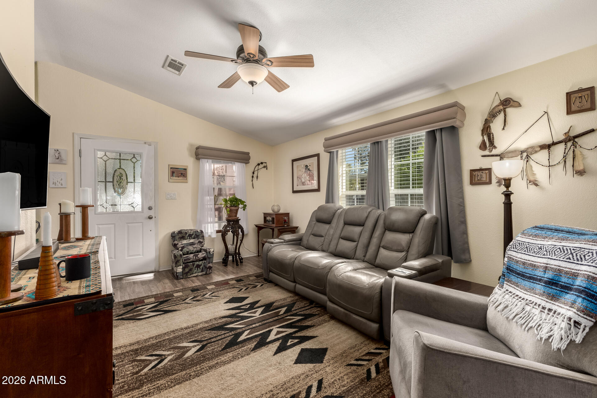 201 South Greenfield Road, Unit 124 Mesa, AZ 85206 - Photo 5 of 31 a living room with furniture ceiling fan and a window