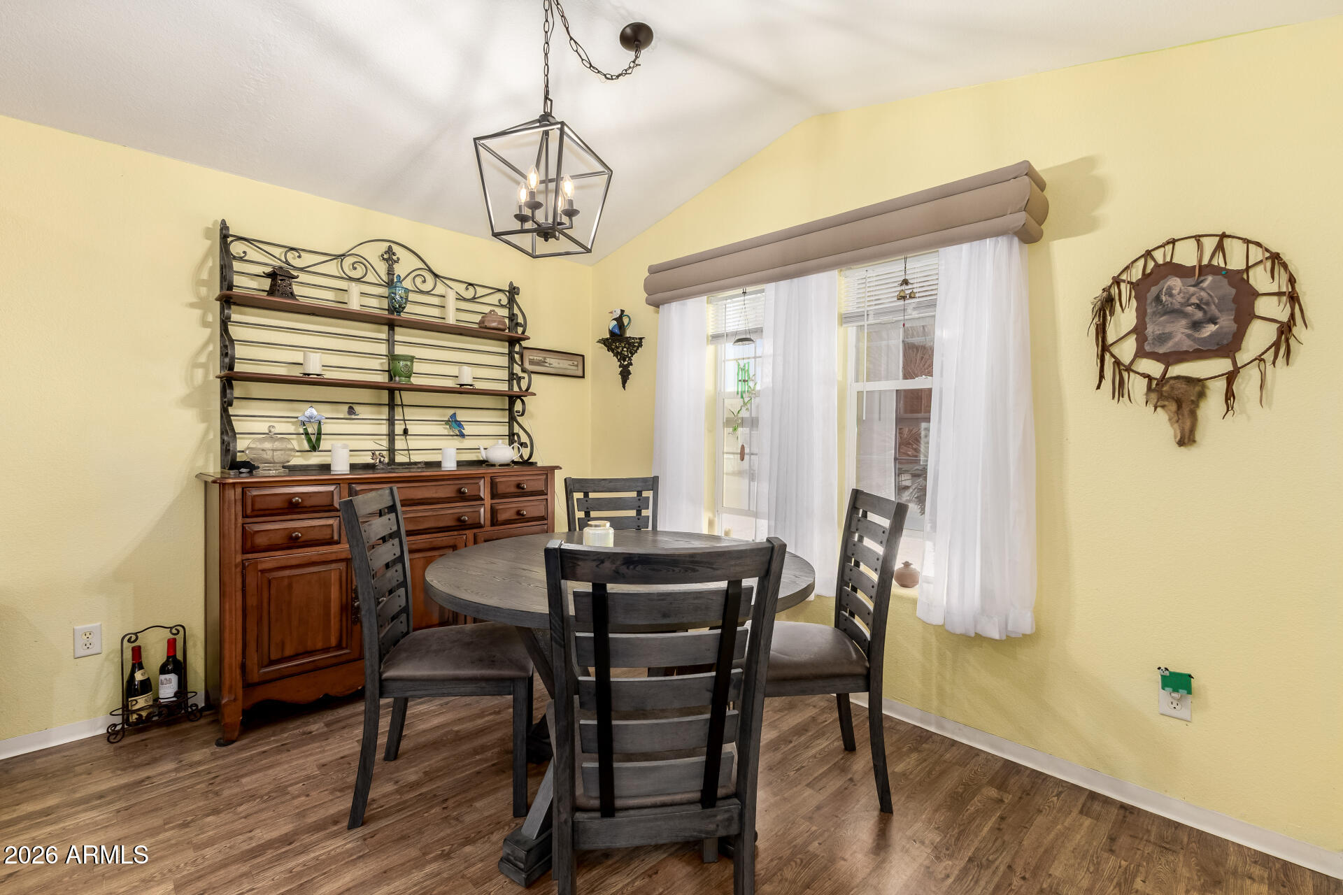 201 South Greenfield Road, Unit 124 Mesa, AZ 85206 - Photo 7 of 31 a view of a dining room with furniture and wooden floor
