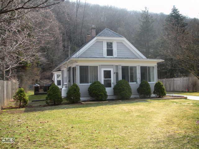 86 Bee Brook Road Washington, CT 06794 - Photo 1 of 1 a front view of a house with a yard