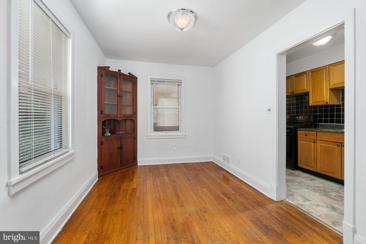 4427 Pen Lucy Road Baltimore, MD 21229 - Photo 8 of 29 Dining Room featuring Hardwood Floors and Hutch