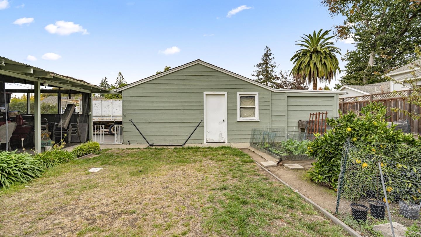 2262 Louis Road Palo Alto, CA 94303 - Photo 35 of 40 a view of a house with a yard and potted plants