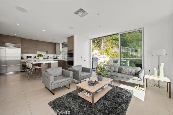 a spacious bedroom with a bed and a couch