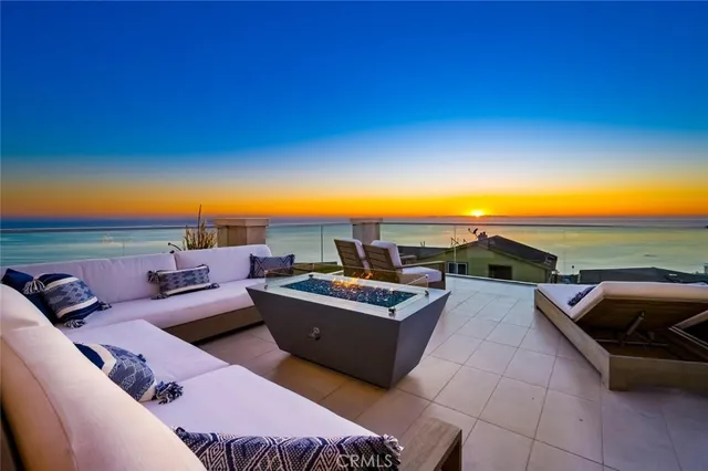 a view of city from balcony with seating space