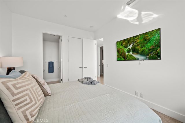 a view of a balcony with furniture and a potted plant
