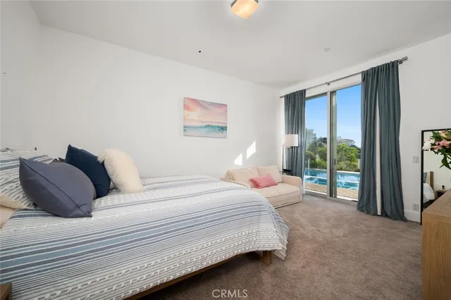 a view of a street with potted plants