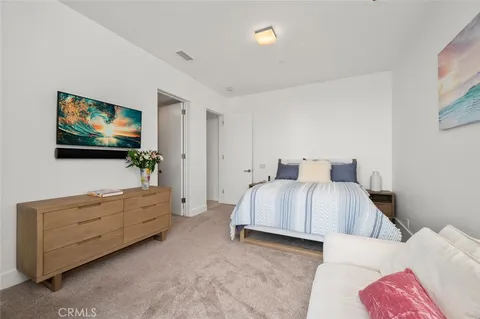 a front view of a houses with yard and outdoor seating