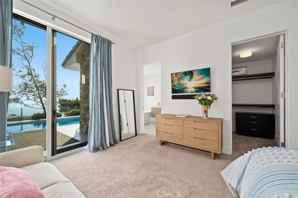 an aerial view of a house with a yard and garden