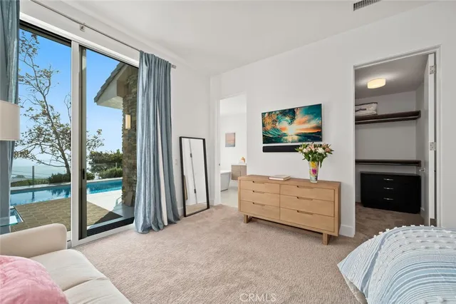 an aerial view of a house with a yard and garden