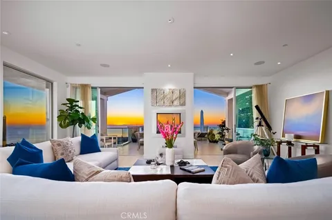 a kitchen with kitchen island a counter top space cabinets and stainless steel appliances