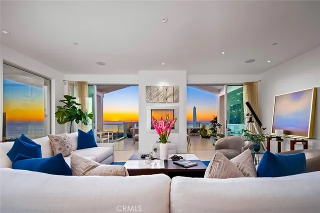a kitchen with kitchen island a counter top space cabinets and stainless steel appliances